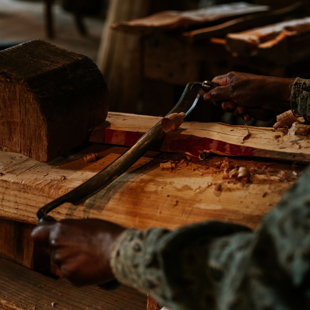a person carving wood