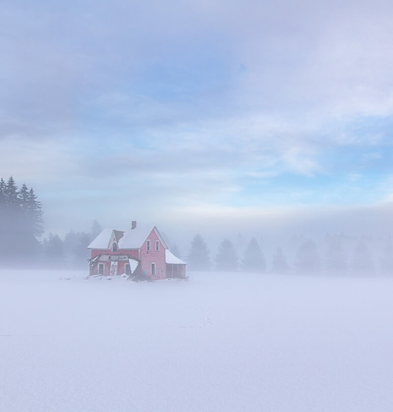 House in the foggy snow