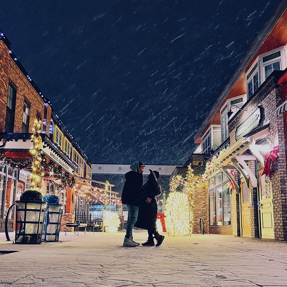 Couple looking at each other in a snowy day