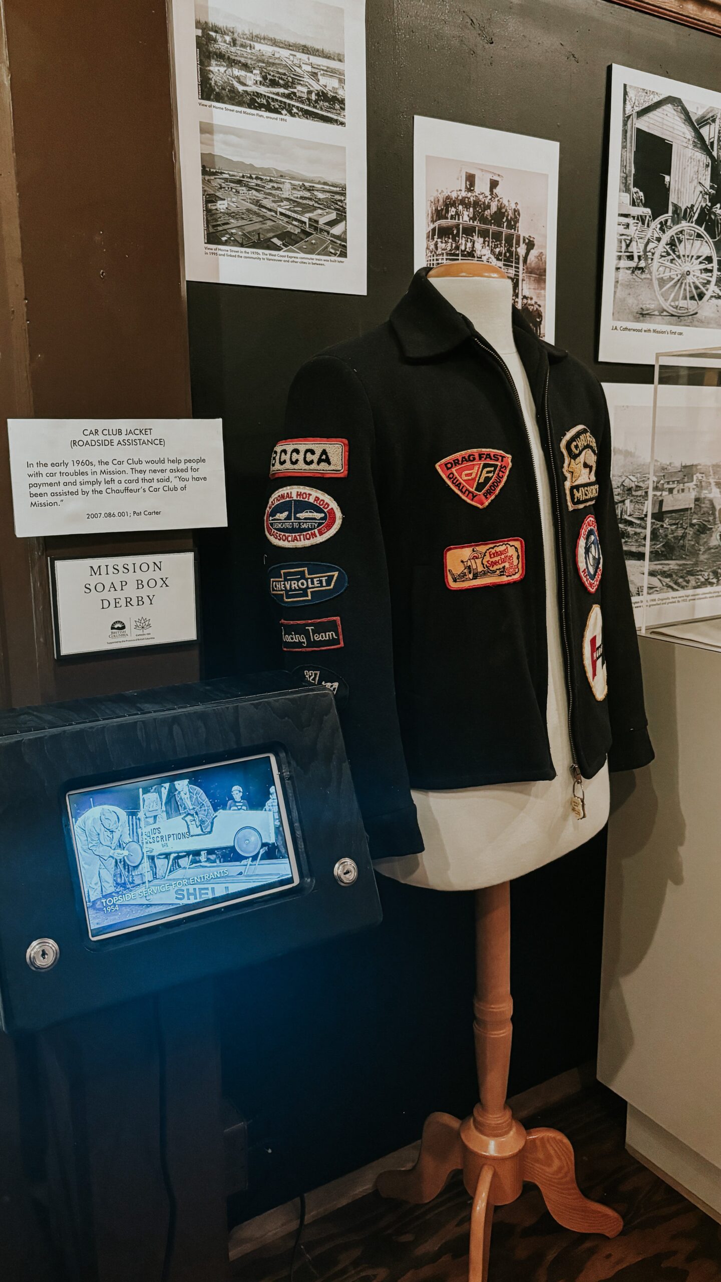 A collection of jackets and other items on display in a museum showcasing history.