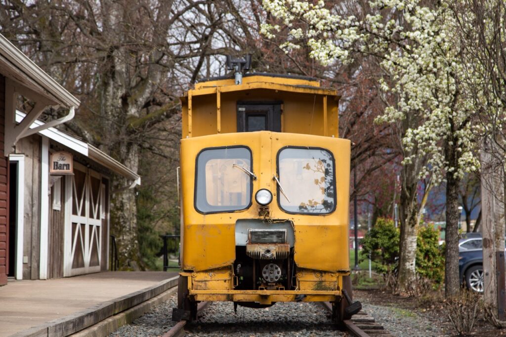 An old yellow train at a museum