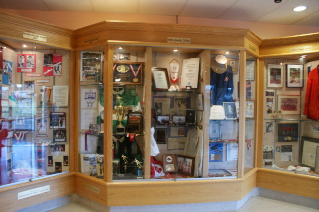 A display case showing various items in the Abbotsford Sports Hall of Fame.