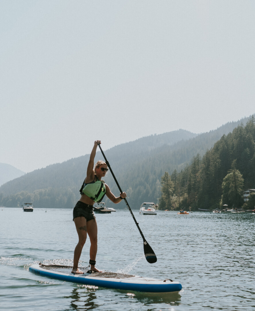 Chilliwack Woman Stand Up Paddleboarding On Lake
