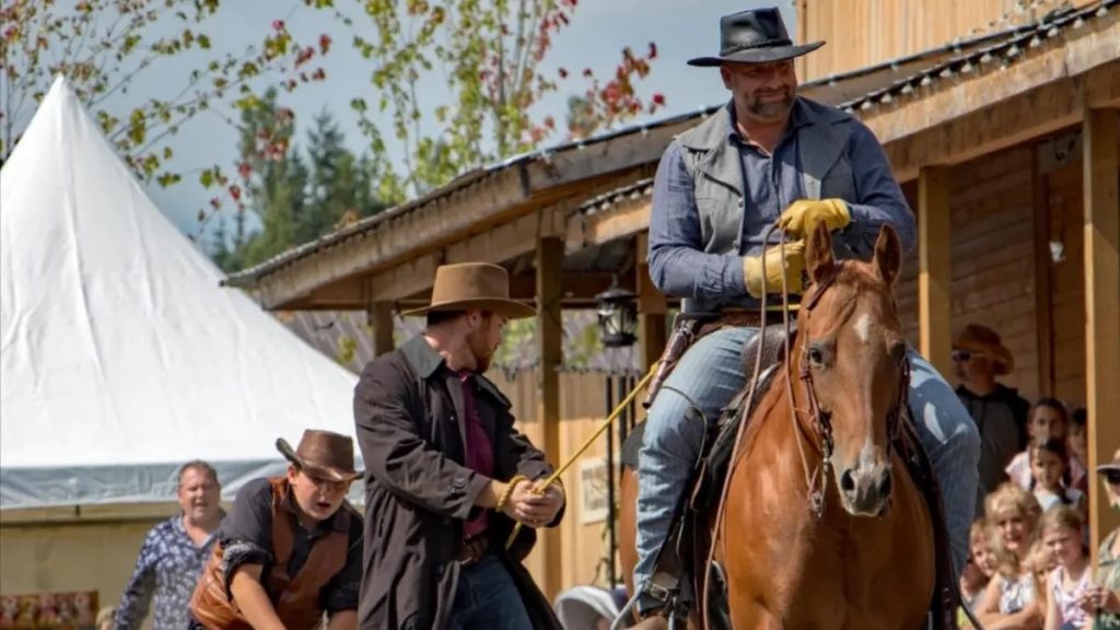 A man on a brown horse