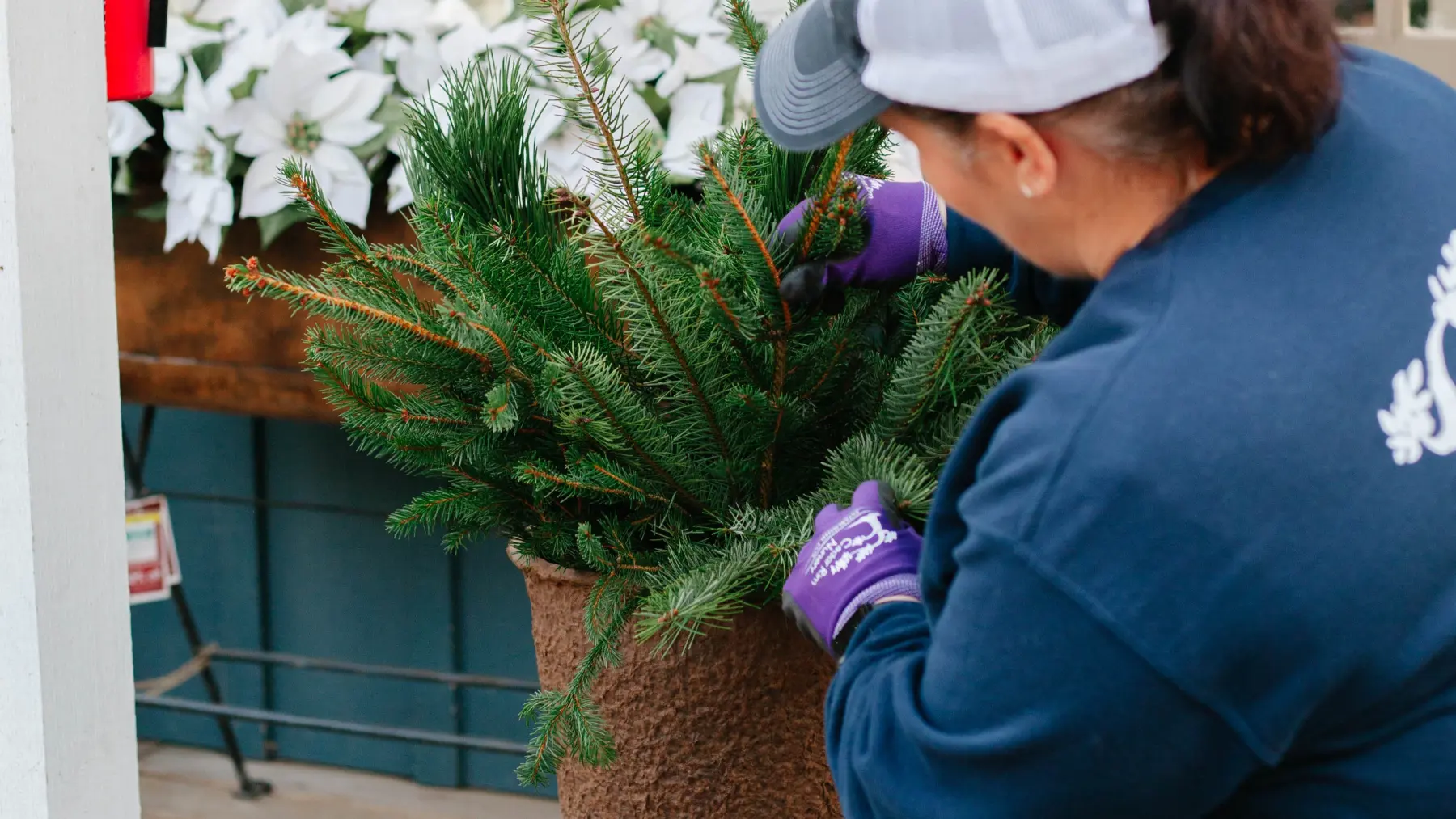 Person making a porch wreath