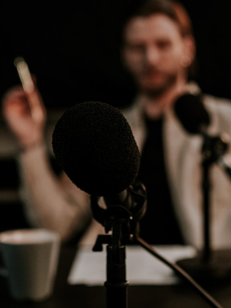 Man behind a microphone