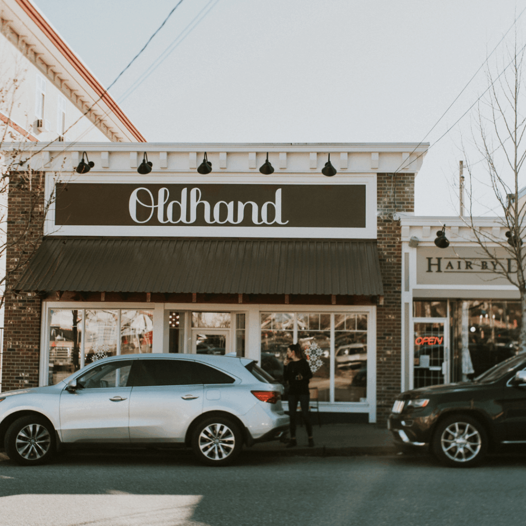a storefront and cars
