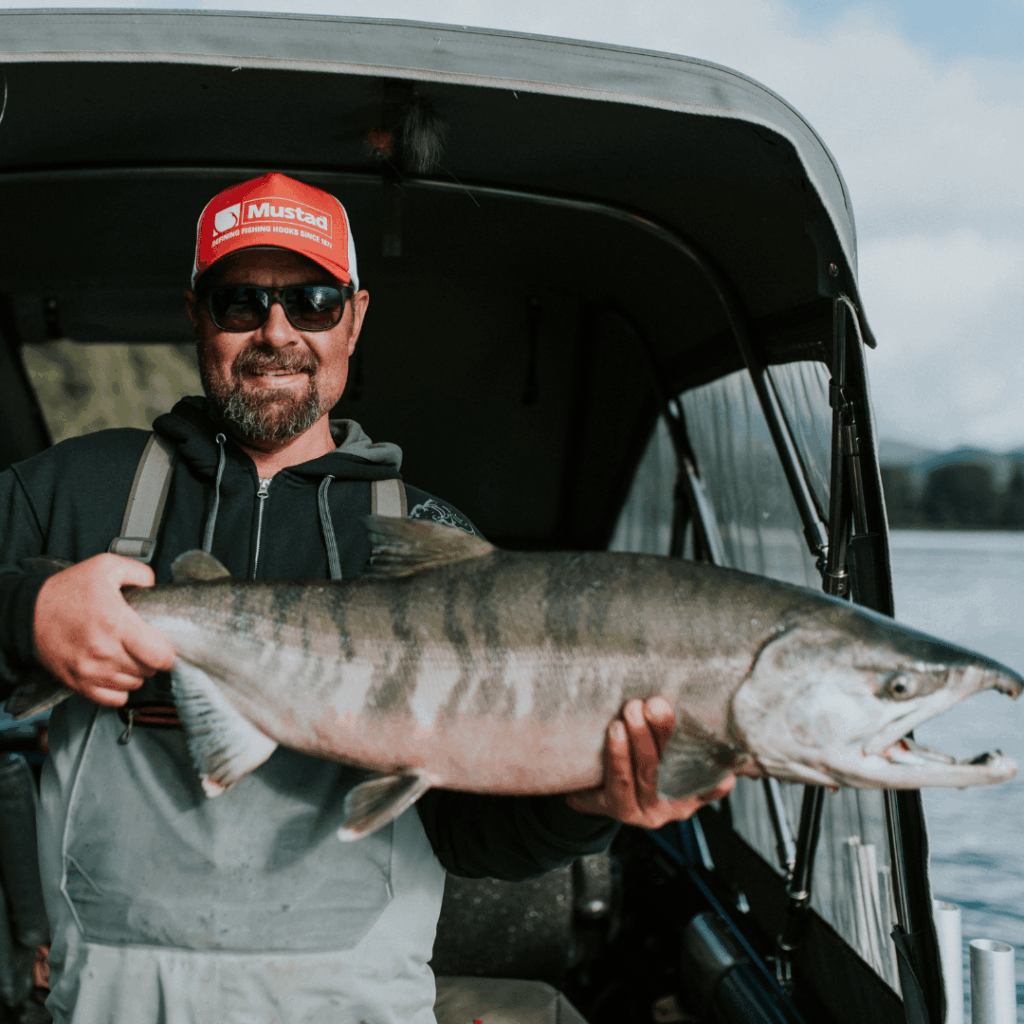 man posing with a fish