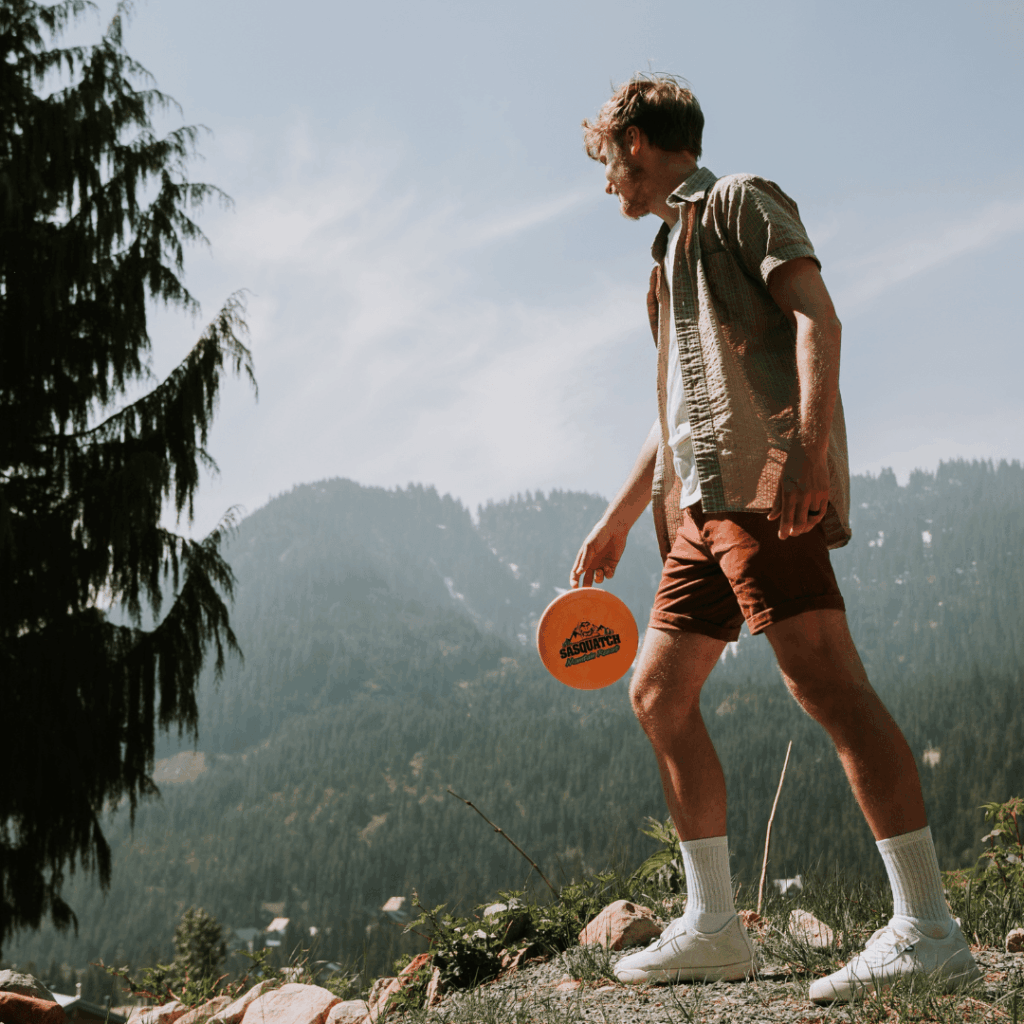 a person winds up to throw a disc