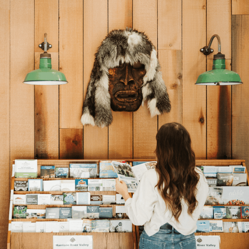 a woman look through visitor guides