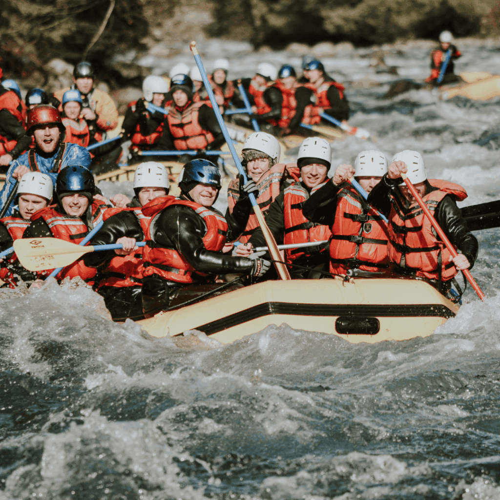A group of people rafting in a river