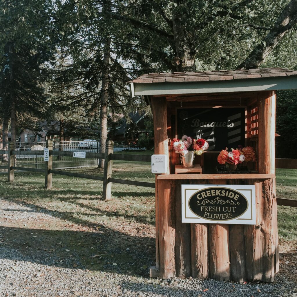 A street stand with flowers on it