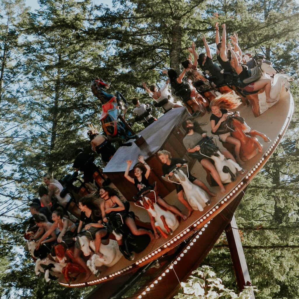 A thrilling ride with people riding with their hands up