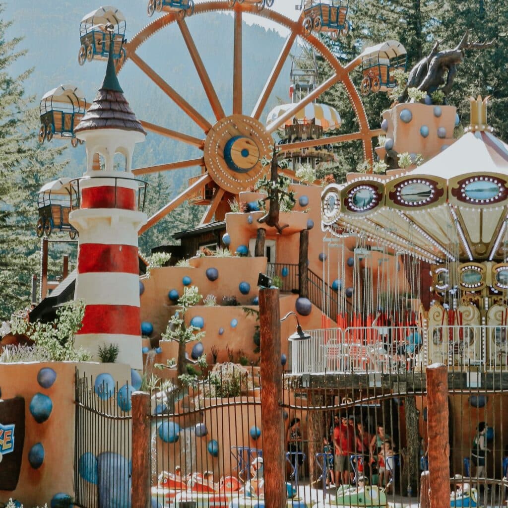 A shot of an adventure park with all it's rides on a sunny day