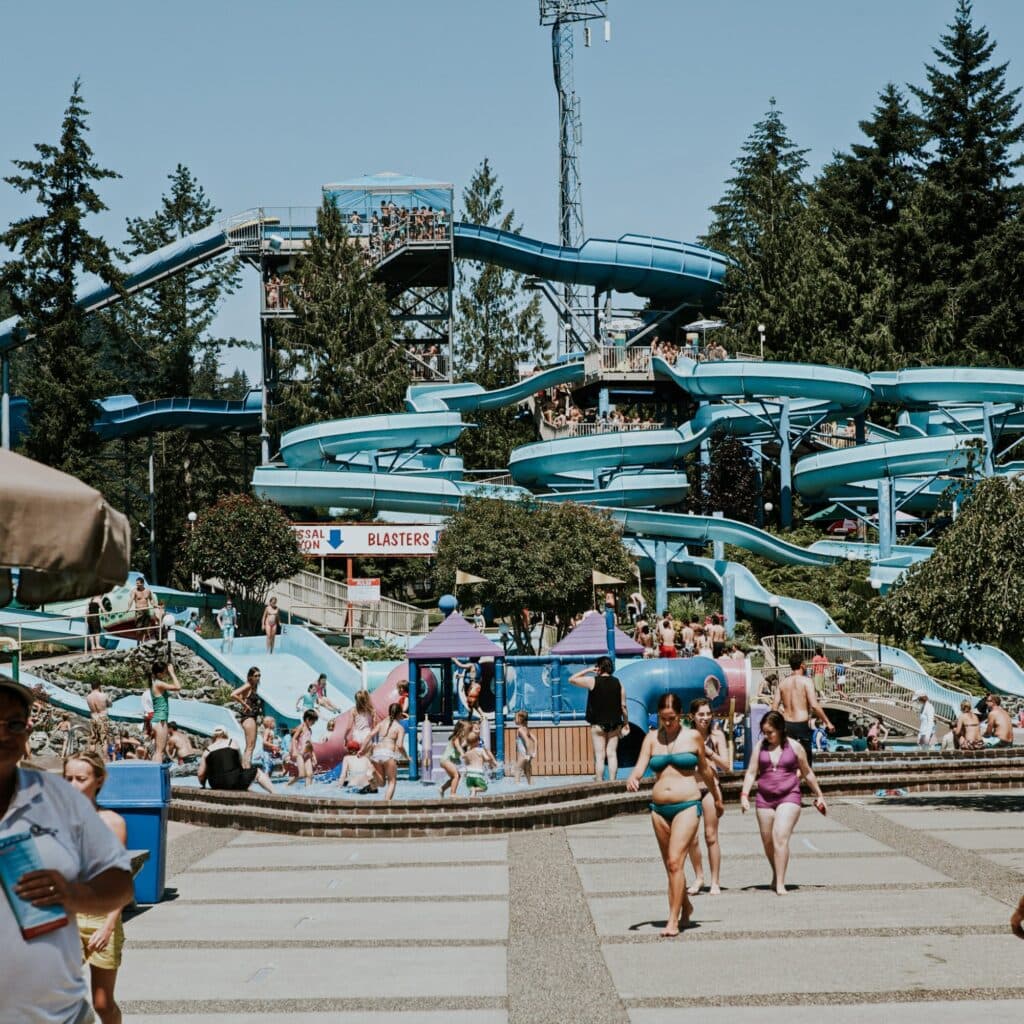A water park with blue slides on a hot summer day