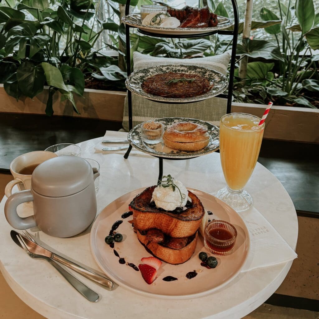 A table full of delicious brunch food and drinks