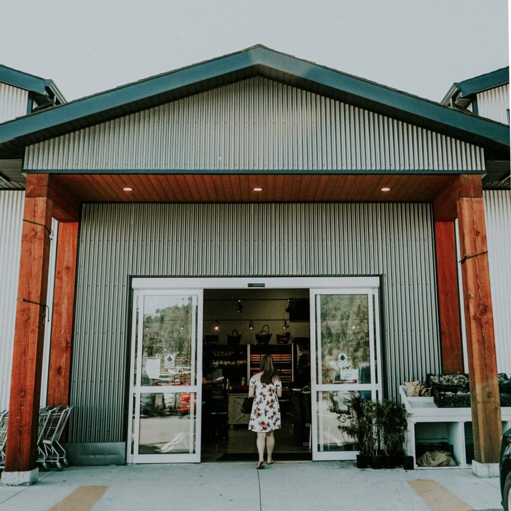 A woman walks into a shop
