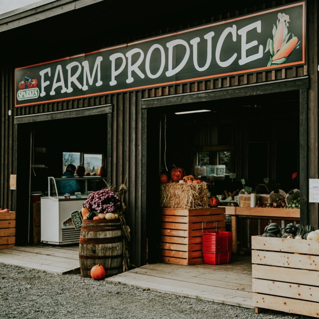 A building with a sign that says farm produce.