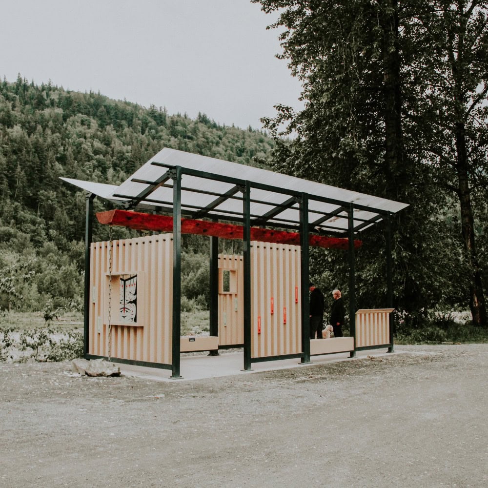 An outdoor structure beside a river