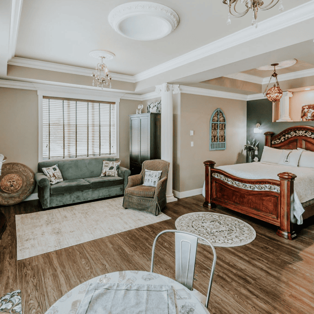 Bedroom with bed and little living area