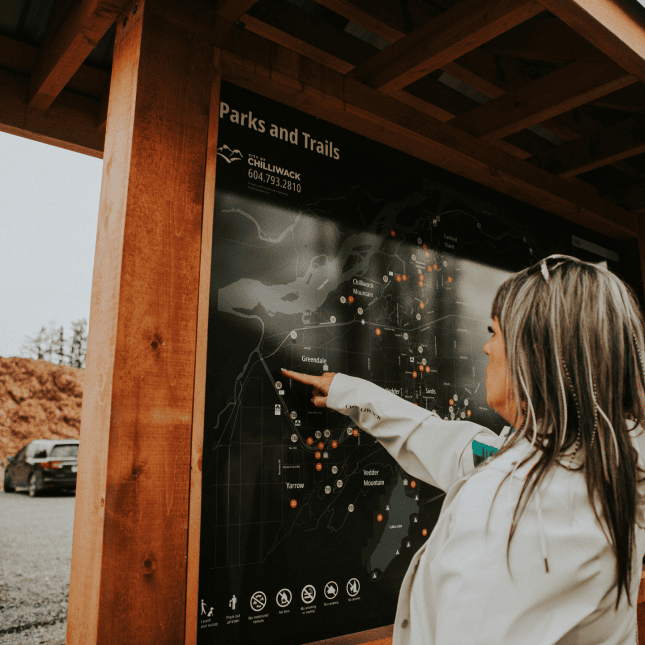 Woman pointing at a map