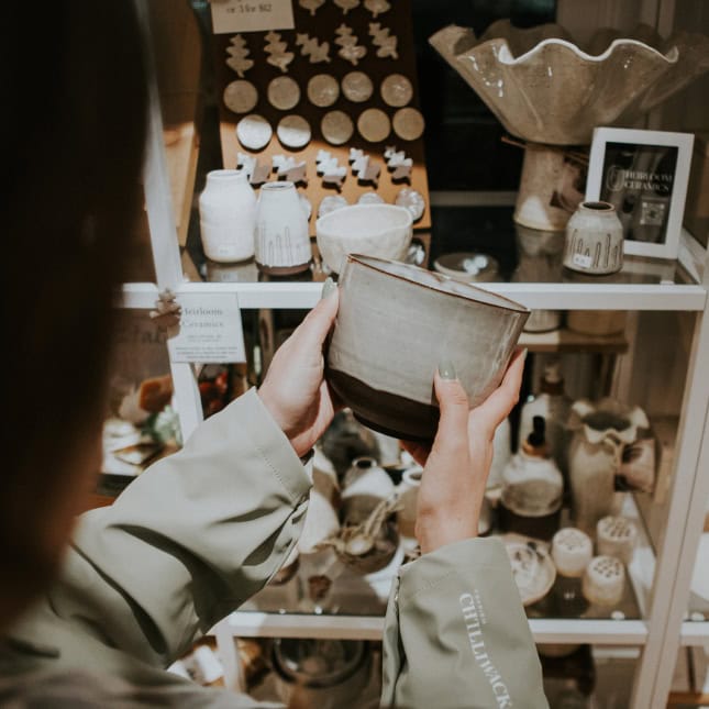 Person holding products from store display