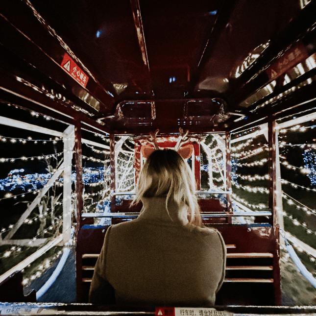 Sitting in train with christmas lights