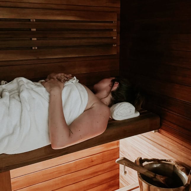 Person laying in sauna