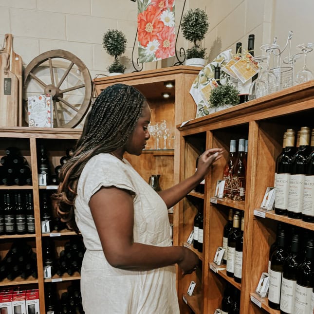 Person looking at wine on display
