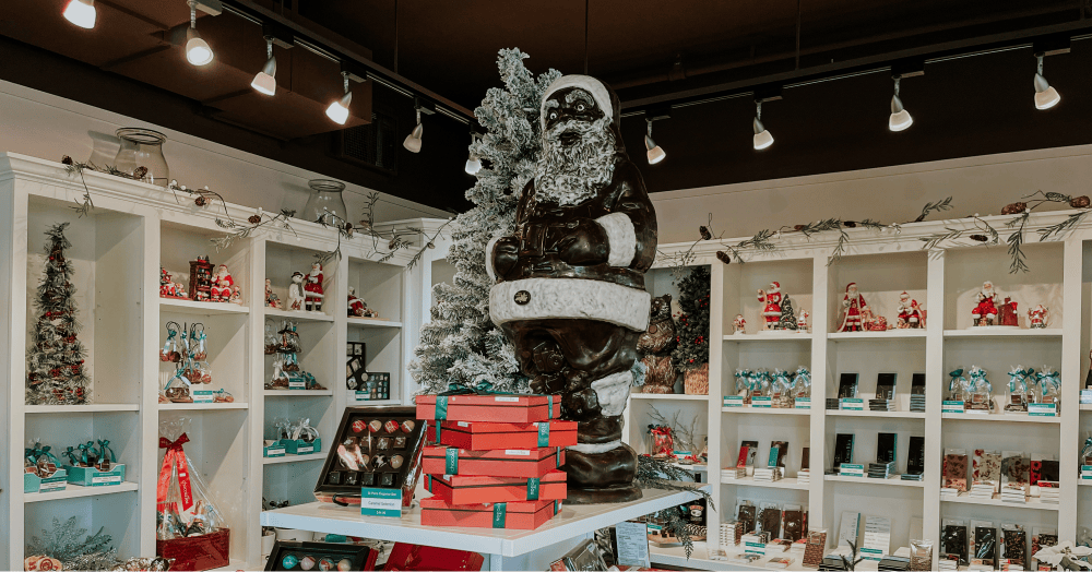 Chocolate Santa on top of the tiered chocolate display