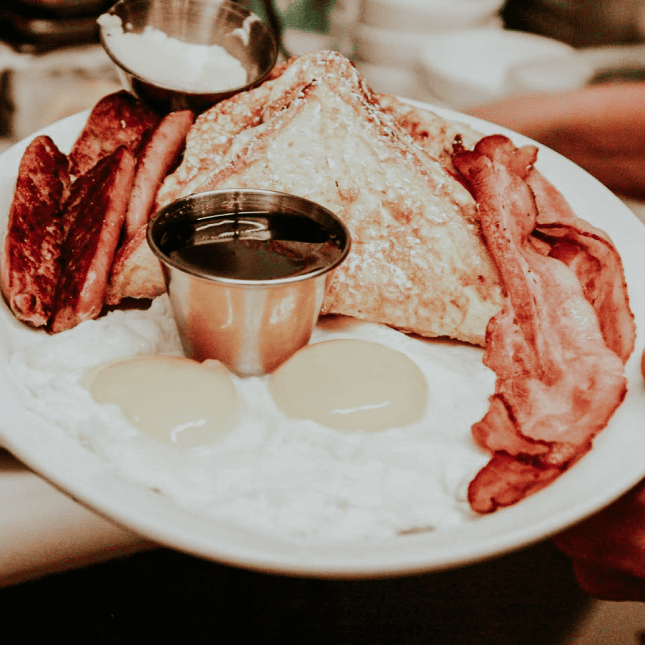 Bacon, waffles and eggs on a plate 