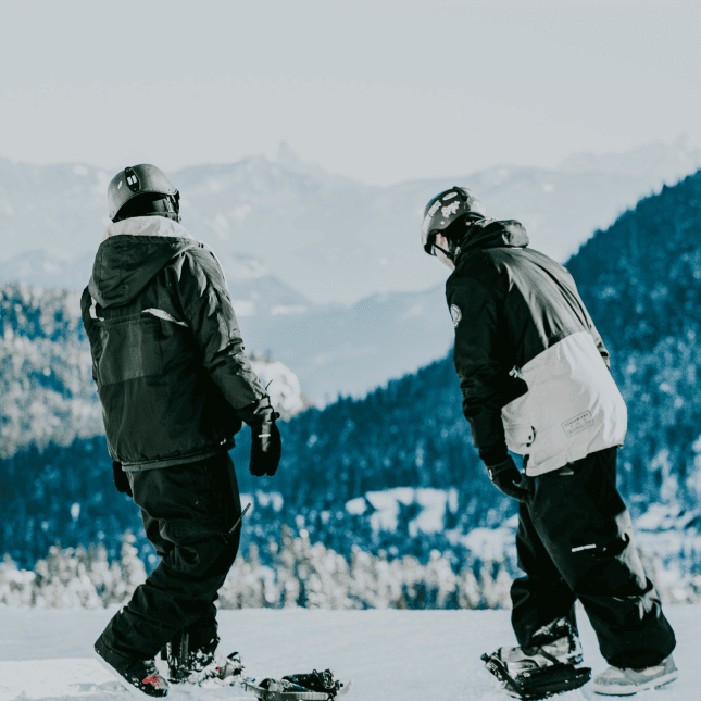 Two people snowboarding