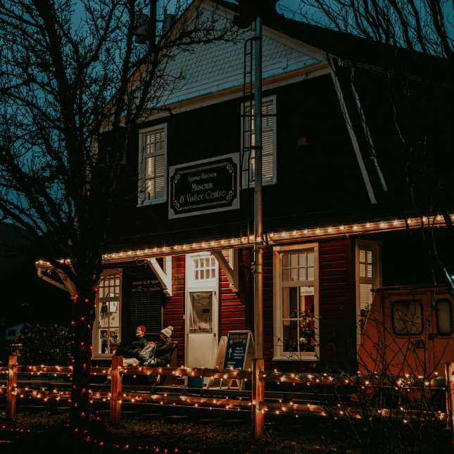 Front of building decorated in Christmas lights 