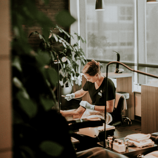 Woman giving a facial treatment 
