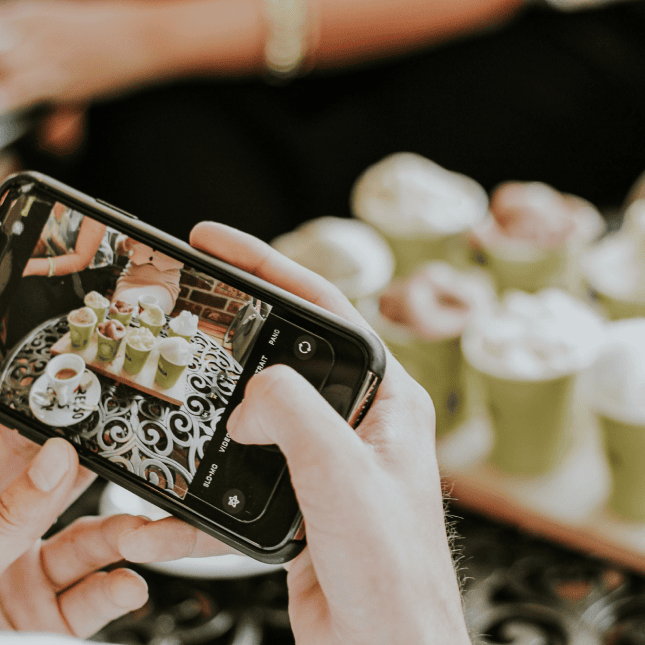 someone taking picture of the drinks 