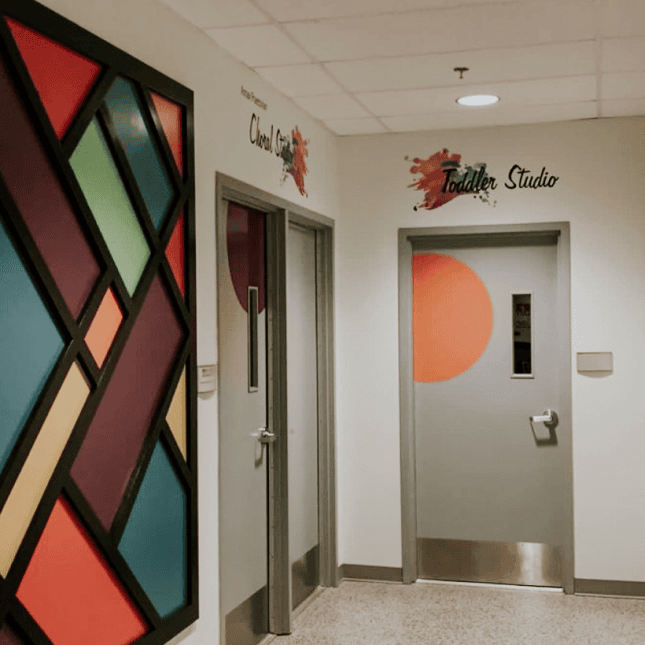 Two doors with painting on the left 