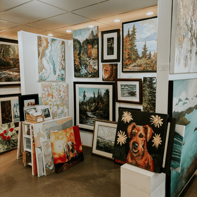 Lots of art in a gallery 