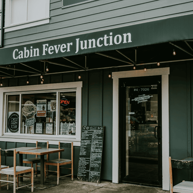 Exterior of the Cabin Fever Junction café with its storefront and entrance visible.
