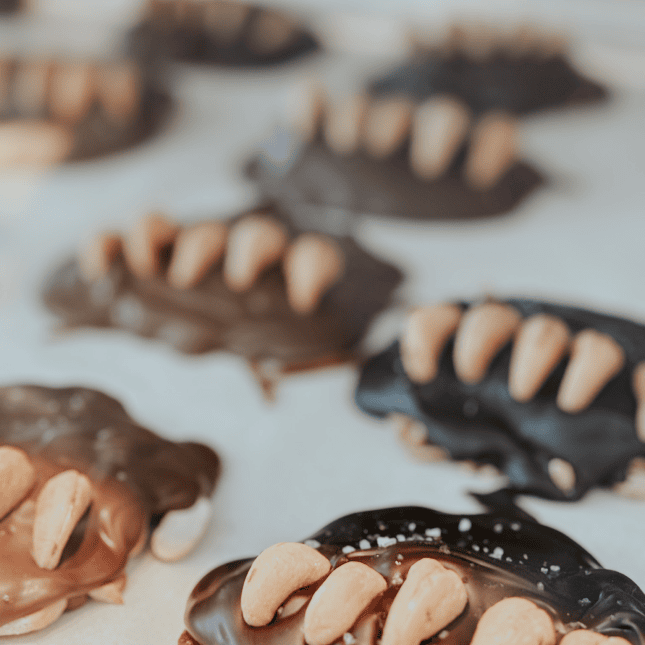 Chocolate-dipped pastries arranged on a baking tray