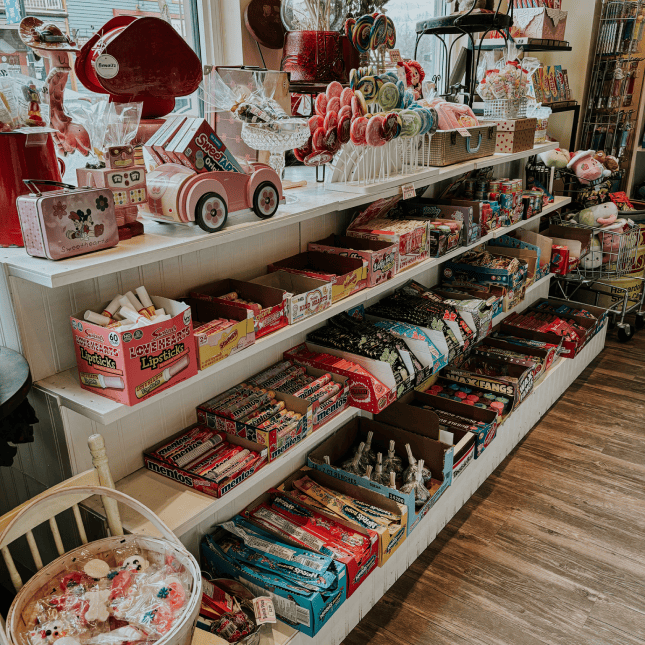 Shelves filled with packaged sweets and candy inside a specialty store.