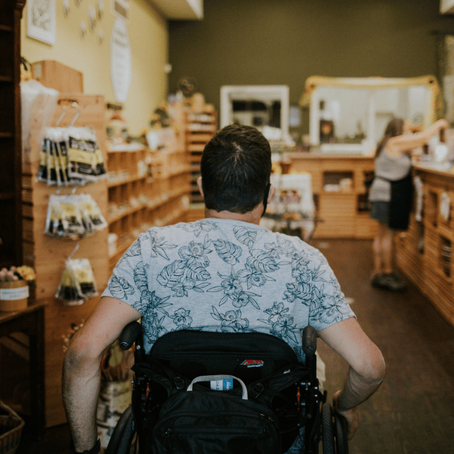 Person browsing products inside a local farm market.