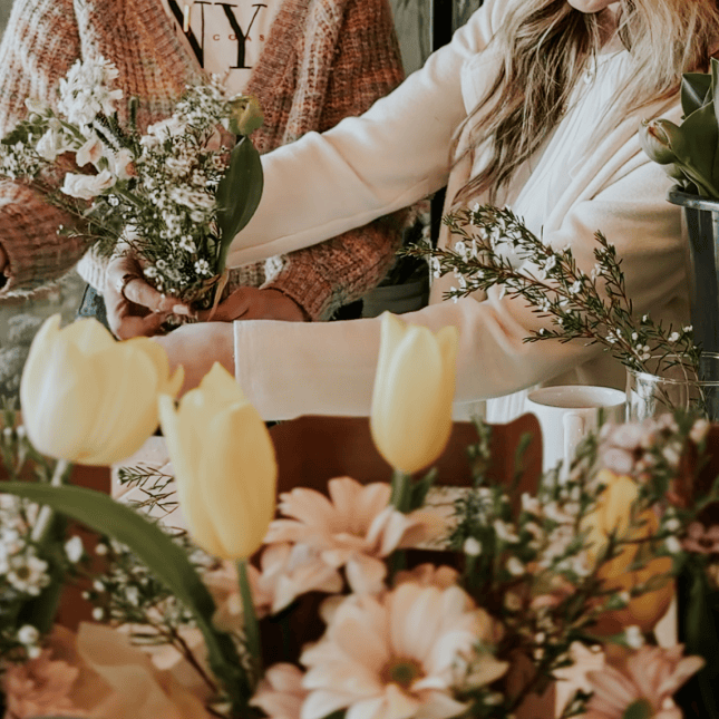Close-up of a bouquet being arranged.