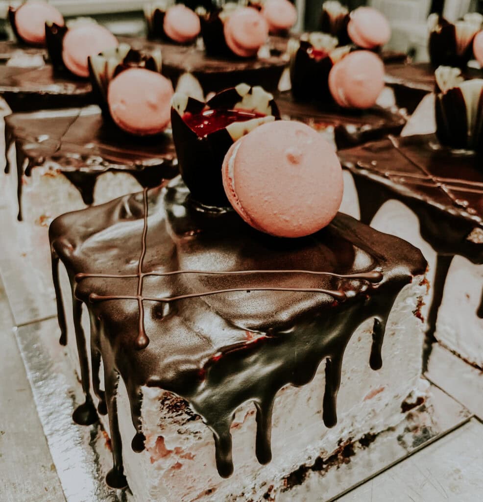 Chocolate dessert squares displayed on a tray.