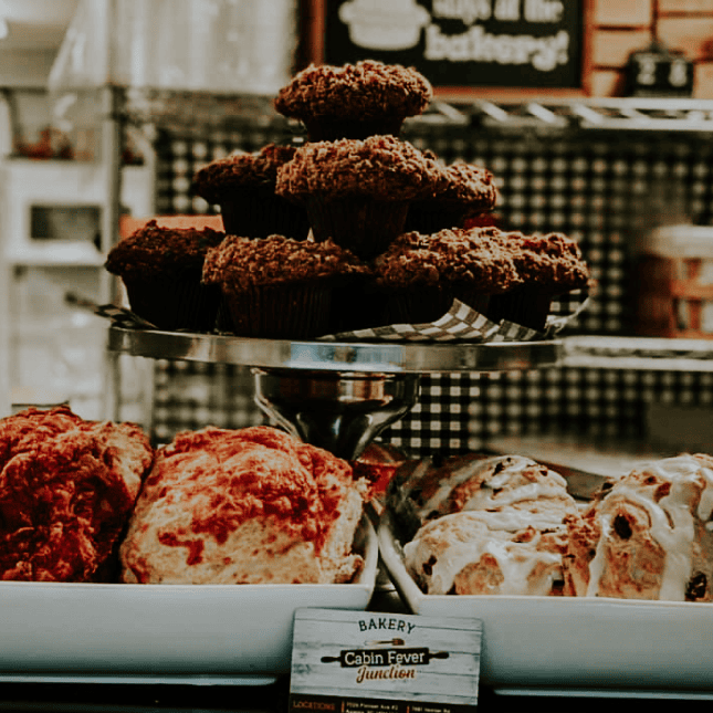 Assorted baked goods arranged in a bakery case.