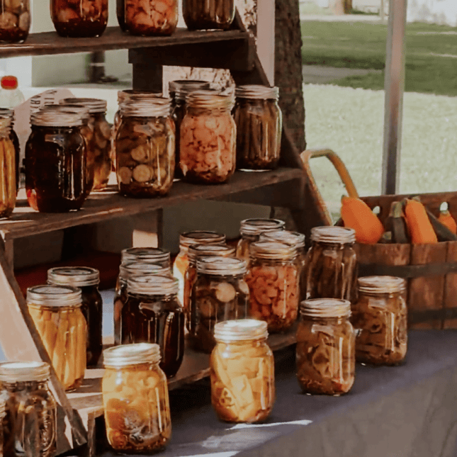 pickling jars on display at a market